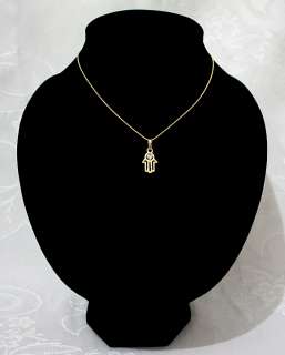 This necklace includes a hamsa amulet, an ancient symbol picturing an 