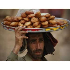  Pakistani Food Vender Displays Food as He Waiting for 