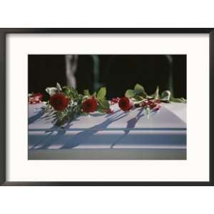 com Roses cover the casket of an officer killed in the Pentagon on 9 