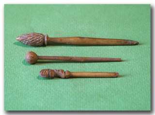 Three Roman Bone Pins with Pine Cone, Deity and Circle  