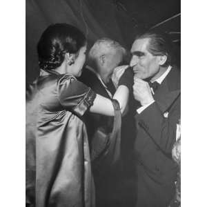 Leyden Kissing Hand of Mrs. Charles Chaplin at Sam Spiegels New Year 
