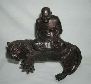 Luang Poh Poen ( Pern ) statue sitting on a Tiger  