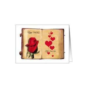  Sweet valentine greeting with rose and heart in an old book 