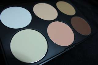   holding 6 large pans for contouring shading blush and concealing the