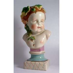  Head and shoulders pottery bust of a small child