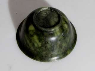 An elegant and finely carved spinach green jade nephrite bowl.