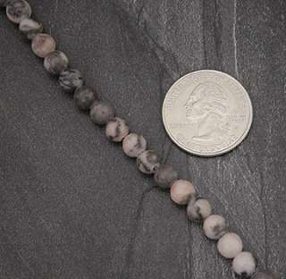Description One Strand of Pink Zebra Agate Stone Beads .
