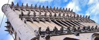gargoyle rain spouts mounted on Notre Dame Cathedral in France 