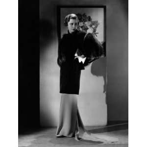 Irene Dunne, Modeling a Sapphire Velvet Evening Coat Trimmed with 