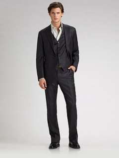 Two button front with peaked lapel Two flap pockets, one ticket pocket 