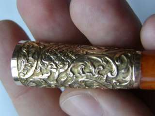   French Repose 14kt Gold&Amber cigar holder.7cm long,1.5cm in diameter